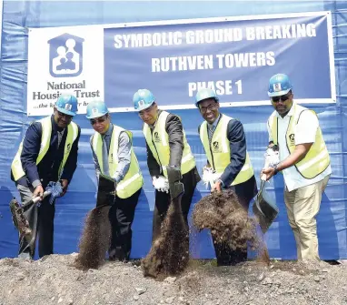  ?? FILE ?? In this September 2017 photo, Prime Minister Andrew Holness (centre) is joined by (from left), Martin Miller, managing director, National Housing Trust (NHT); Cabinet member Dr Horace Chang; chairman of the NHT Dr Nigel Clarke, and Member of Parliament...