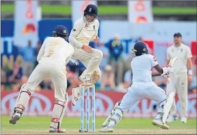  ??  ?? Joe Root leaps in the air to avoid being hit as the home side’s Akila Dananjaya played a shot in Sri Lanka
