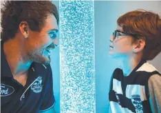  ?? Picture: ALISON WYND ?? Cat Gary Rohan and Spencer Baum, 11, check out the new sensory room at GMHBA Stadium.