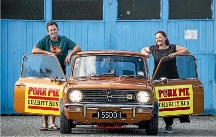  ?? BRADEN FASTIER/STUFF ?? Shaw Elmsly and Amy Langfield are getting ready to hit the road in their 1978 Mini Clubman ‘‘Pigmy’’ as part of this year’s Pork Pie Charity Run. The couple have raised nearly $3000 for Kids Can, but hope to reach at least $5000.