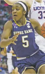  ?? ASSOCIATED PRESS FILE PHOTOS ?? Notre Dame’s Jackie Young, left, and Mississipp­i State’s Victoria Vivians, far right, have helped lead their teams to Sunday’s title game in Columbus, Ohio.