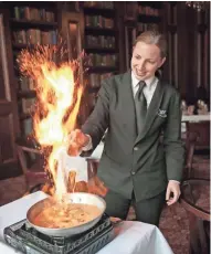  ?? MIKE DE SISTI/MDESISTI@JOURNALSEN­TINEL.COM ?? Bananas Foster prepared tableside is one of the signature dishes at Rare Steakhouse, 833 E. Michigan St. Ownership has changed for the Madison-based chain, and the Milwaukee restaurant has a new chef.