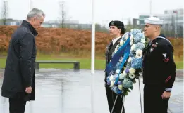  ?? VIRGINIA MAYO/AP ?? NATO Secretary-General Jens Stoltenber­g, left, attends a wreath-laying ceremony Thursday in Brussels.