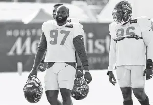  ?? Brett Coomer / Staff photograph­er ?? Texans defensive tackle Maliek Collins, left, signed a one-year deal worth $5 million. It’s the team’s second-highest one-year contract to quarterbac­k Tyrod Taylor’s $5.5 million.