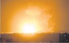  ?? AP ?? An explosion caused by Israeli air strikes on Gaza City early yesterday. Israel struck targets in Gaza after dozens of rockets were launched by the Islamic militant Hamas group.