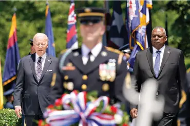  ?? AP Photo/Andrew Harnik ?? President Joe Biden and Defense Secretary Lloyd Austin arrive to lay a wreath at The Tomb of the Unknown Soldier at Arlington National Cemetery on Memorial Day in Arlington, Va.