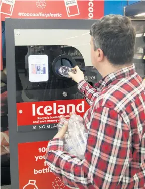  ??  ?? RETURN Shoppers can exchange plastic bottles for vouchers. Picture: Alistair Linford