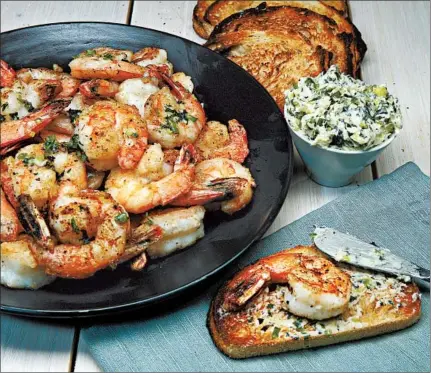  ?? TERRENCE ANTONIO JAMES/CHICAGO TRIBUNE ?? Shrimp are dusted with cornstarch before a quick spin in a hot skillet. The crispy crustacean­s partner with a mint-chile butter.