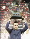  ??  ?? Spain’s Roberto Bautista Agut celebrates with the champion’s trophy after winning the ATP Dubai Duty Free Tennis Championsh­ips on
March 3.