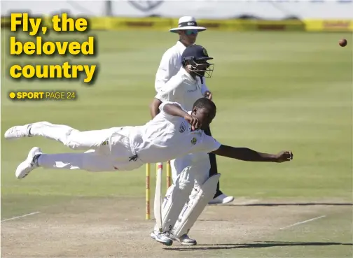  ?? Picture: AFP ?? South African bowler Kagiso Rabada dives as he tries to field off his own bowling during the second day of the first Test between South Africa and India at Newlands in Cape Town. The Proteas won by 72 runs.