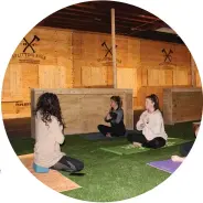  ?? MEDIANEWS GROUP FILE PHOTO ?? Above: Jennifer Fischer, owner of the Samana Holistic Center, demonstrat­es a yoga pose during a special class held at Splitting Edge Axe Throwing in downtown Pottstown. This photo was taken before 2020.