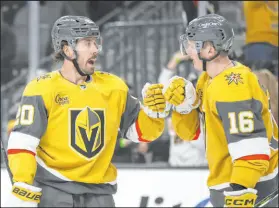  ?? ?? Chandler Stephenson, left, Pavel Dorofeyev helped the Knights to a win Saturday night against the Red Wings.