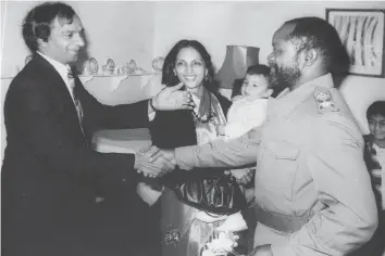  ??  ?? Mozambique’s founding father the late President Samora Machel greets Mr Popatlal and his family during one of his visits at their home