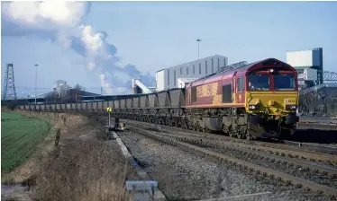  ??  ?? ABOVE: With Ferrybridg­e Power Station generating in the background
and Kellingley Colliery winding coal immediatel­y behind the train, EWS 66206 passes
Sudforth Lane in charge of the 6H14 0921 Gascoigne
Wood to Drax Power Station.