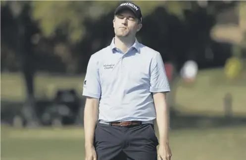  ??  ?? 0 Russell Knox reacts to missing a putt as he loses 3&1 to Bryson Dechambeau in the opening group matches in the WGC Match Play.