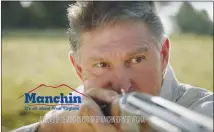  ?? YOUTUBE SCREENSHOT ?? Sen. Joe Manchin, D-W. Va., takes figurative aim in a campaign ad at his Republican opponent’s position on the Affordable Care Act and the protection­s it offers patients with pre-existing medical conditions. Democratic candidates in congressio­nal races across the country this fall are unapologet­ically putting health care at the center of their campaign messages.