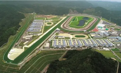  ?? Picture: Hong Kong Jockey Club ?? BRAND NEW: An aerial view of Conghua Racecourse in China’s Guangdong province, which was officially opened last week. Built by the Hong Kong Jockey Club for HK$3.7 billion over seven years, the state-of-the-art facility covers 150 hectares in a smog-free and equine disease-free zone. It has stabling for 660 horses and will initially serve as a satellite training and spelling centre for operations in Hong Kong, with the 200km journey for horses to the enclave taking about four hours. Betting is currently banned in mainland China but a gambling licence for Conghua is under considerat­ion.