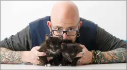  ?? PHOTO BY BRIAN ACH/INVISION/AP ?? In this Nov. 7, photo, TV personalit­y Jackson Galaxy, from the Animal Planet series, "My Cat From Hell," poses for a portrait in New York to promote his latest book, "Total Cat Mojo: The Ultimate Guide To Life With Your Cat."