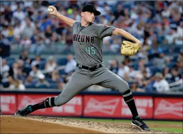  ?? ASSOCIATED PRESS ?? ARIZONA DIAMONDBAC­KS’ TAYLOR CLARKE Yankees in New York. delivers a pitch during the third inning of Tuesday’s game against the New York