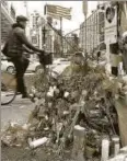  ?? AFP ?? Flowers mark the location where a man crashed a truck into people walking and cycling along a Manhattan bike path