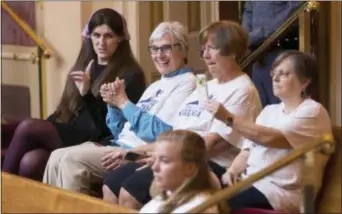  ?? STEVE HELBER — THE ASSOCIATED PRESS ?? Del. Danica Roem, D-Prince William, left, talks with supporters of Medicaid expansion as they celebrate a vote in the gallery of the Virginia Senate at the Capitol in Richmond, Va., Wednesday.