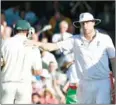  ?? AFP ?? Andrew Flintoff (right) consoles Australia’s Ben Hilfenhaus after England win the Ashes in 2009.