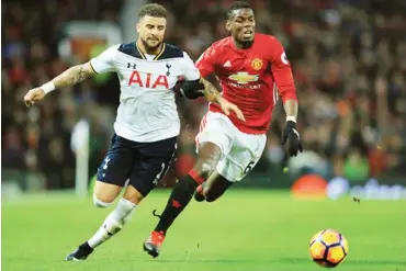  ??  ?? Kyle Walker of Tottenham Hotspur and Paul Pogba of Manchester United compete for the ball during a Premier League match at Old Trafford on December 11, 2016 in Manchester, England.