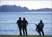  ?? ARIC CRABB — BAY AREA NEWS GROUP, FILE ?? Josh Duhamel, left, and Toby Keith, second from left, wait along the 18th fairway during the 3M Celebrity Challenge in February 2018 at the Pebble Beach Golf Links in Carmel.