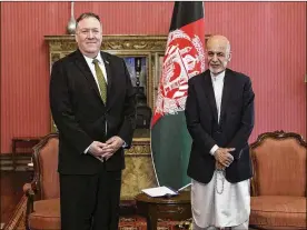  ?? ASSOCIATED PRESS ?? Secretary of State Mike Pompeo stands with Afghan President Ashraf Ghani at the Presidenti­al Palace in Kabul on Monday. Pompeo was in Kabul on an urgent visit to try to move forward a U.S. peace deal signed last month with the Taliban — a trip that came when world leaders and statesmen are curtailing official travel.