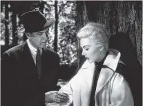  ?? UNIVERSAL STUDIOS VIA AP ?? Jimmy Stewart, left, and Kim Novak appear in a scene from “Vertigo.” On Sunday, as part of the TCM Big Screen Classics series, “Vertigo” will be back in theaters with an encore March 21.