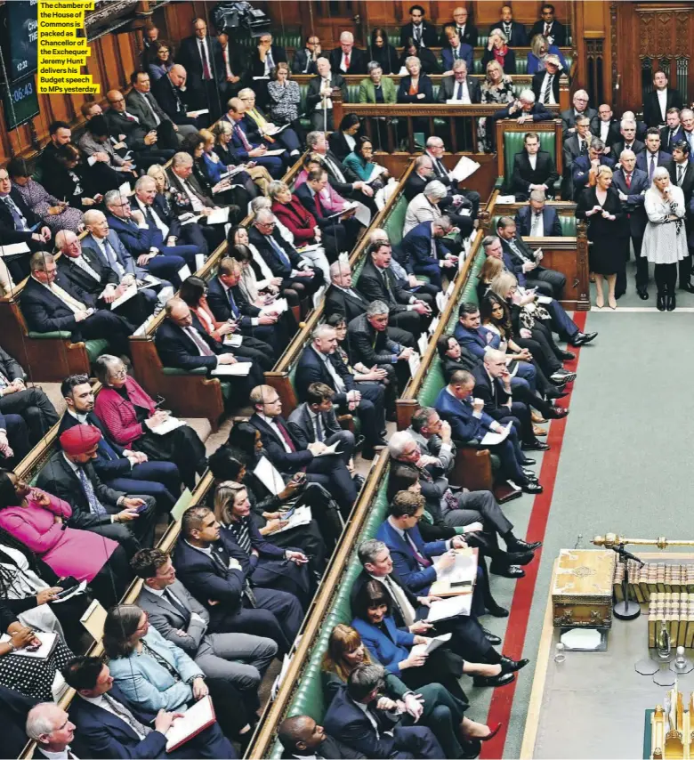  ?? ?? The chamber of the House of Commons is packed as Chancellor of the Exchequer Jeremy Hunt delivers his Budget speech to MPS yesterday