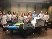  ?? Contribute­d ?? Giving back: Evers, Cox and Gober donated profession­al clothing to Southern Arkansas University’s Career Closet on the first ever CPA Day of Service.