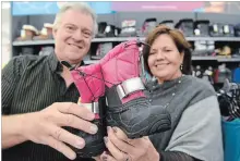  ?? STEVE HENSCHEL
NIAGARA THIS WEEK ?? Both Giant Tiger Welland owner Wayne Zatorski and Open Arms Mission assistant chaplain Carol Hand are ready for Boots 4 Kids.