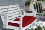  ??  ?? An inviting seat, like a swing with cushions, can elevate the porch’s role in your home.