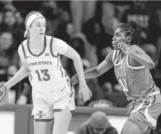  ?? Charlie Neibergall / Associated Press ?? Joanne Allen-Taylor, right, helped Texas improve to 6-1 on the road with wins against Iowa State on Wednesday and TCU on Saturday. Allen-Taylor finished with 14 points against TCU.