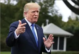  ?? MANUEL BALCE CENETA, THE ASSOCIATED PRESS ?? Donald Trump speaks to reporters on the south lawn of White House on Friday.