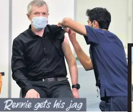  ??  ?? A REAL SHOT IN THE ARM Scottish Lib Dem leader Willie Rennie got his first dose of the coronaviru­s vaccine in Perth, from clinician Dilen Divecha