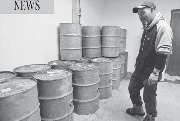  ?? LAURA PEDERSEN / NATIONAL POST ?? “Most of the guys they just can’t fight anymore. They don’t have any money left,” says Steve Côté, loading barrels of maple syrup into a storage area in his Quebec sugar shack.