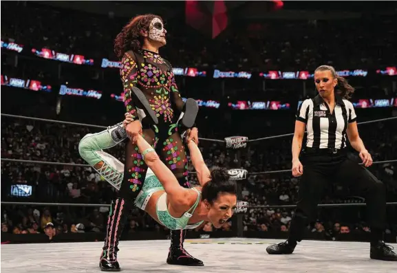  ?? Courtesy All Elite Wrestling ?? San Antonio’s Thunder Rosa, top, is auctioning her ring gear, which she wore at an AEW pay-per-view event, to raise funds for families affected in Uvalde.