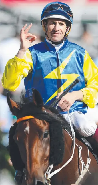  ?? Picture: MICHAEL KLEIN ?? It was once again the traditiona­l salute for Hugh Bowman after sealing victory aboard the Kris Leestraine­d Le Romain in the Cantala Stakes (1600m) at Flemington yesterday