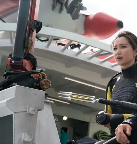  ??  ?? Jason Statham and co-star Li Bingbing in a scene from his action-packed new movie in which Statham has to save several people who have been trapped in a submersibl­e that is under attack by a prehistori­c Megalodon shark