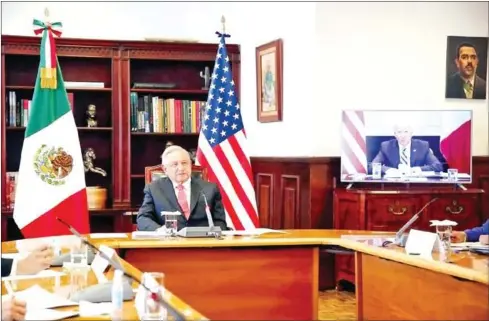  ?? MEXICAN PRESIDENTI­AL PRESS OFFICE ?? Mexican President Andres Manuel Lopez Obrador discusses immigratio­n, Covid-19 and commercial issues with his US counterpar­t Joe Biden via video link on Monday.