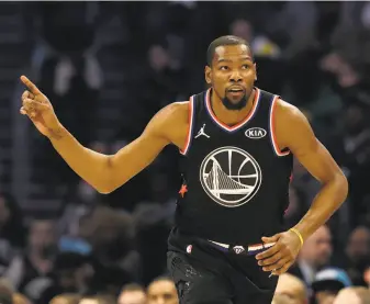  ??  ?? Warriors forward Kevin Durant showed himself to be a star among All-Stars, scoring 31 points for Team LeBron to earn Most Valuable Player honors in the game for the second time.