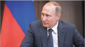  ?? ALEXANDER ZEMLIANICH­ENKO, AP ?? The Kremlin says Russian President Vladimir Putin’s conversati­on with President Trump on Tuesday was “business-like and constructi­ve.”
