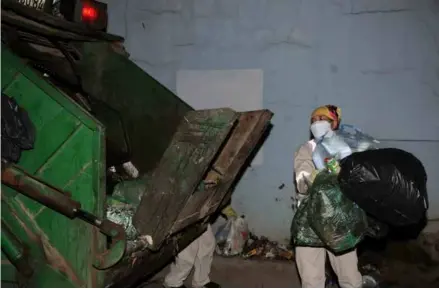  ?? VNA/VNS Photo Quang Quyết ?? Đặng Hồng Thêm, 42, a sanitation worker at Sơn La City’s Urban Environmen­t Company, collects waste in Sơn La City in the northern mountainou­s province of Sơn La.