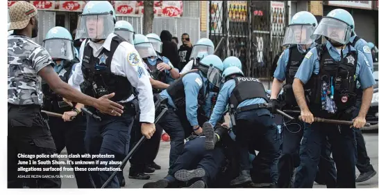  ?? ASHLEE REZIN GARCIA/SUN-TIMES ?? Chicago police officers clash with protesters June 1 in South Shore. It’s unknown if any abuse allegation­s surfaced from these confrontat­ions.