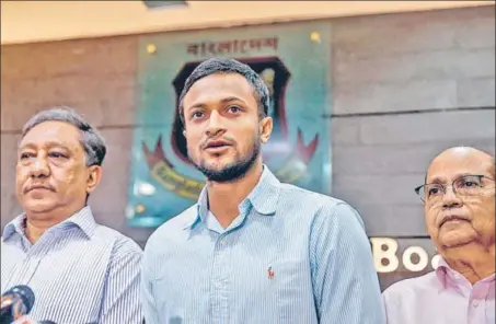  ?? AFP ?? Shakib Al Hasan (C) attended a press conference in Dhaka on Tuesday after his ban from all forms of cricket for two years, with one year suspended.