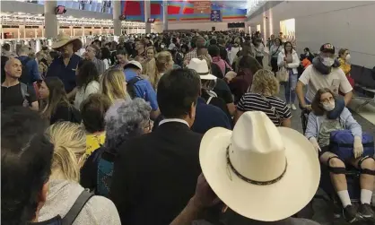  ??  ?? People wait in line to go through the customs at Dallas Fort Worth Internatio­nal Airport in Grapevine, Texas. Photograph: Austin Boschen/ AP