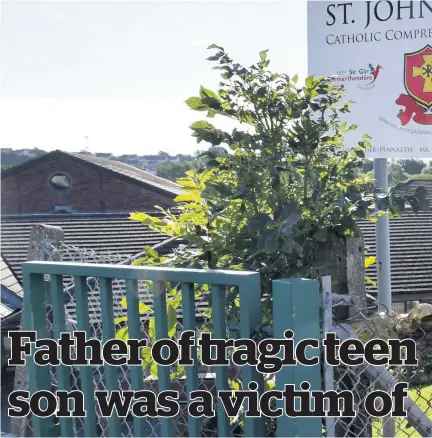  ??  ?? Floral tributes left at the gates of St John Lloyd Catholic Comprehens­ive School after a child died in hospital after
