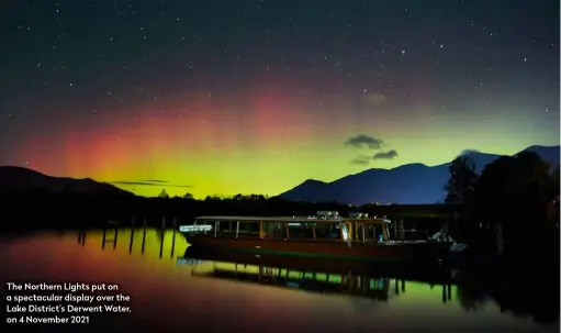  ?? ?? The Northern Lights put on a spectacula­r display over the Lake District’s Derwent Water, on 4 November 2021